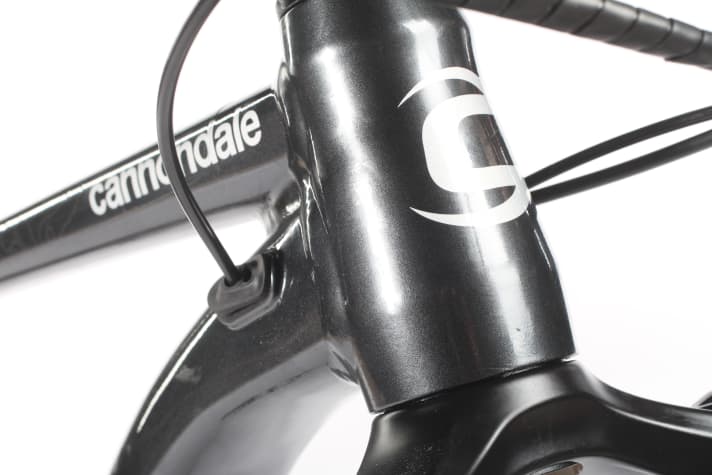   The cables are routed inside the main frame and exit through a large opening under the bottom bracket. This solution is easy to service.