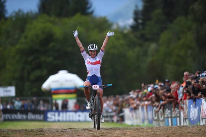   Evie Richards is celebrated by the spectators on the final metres to her World Championship title.
