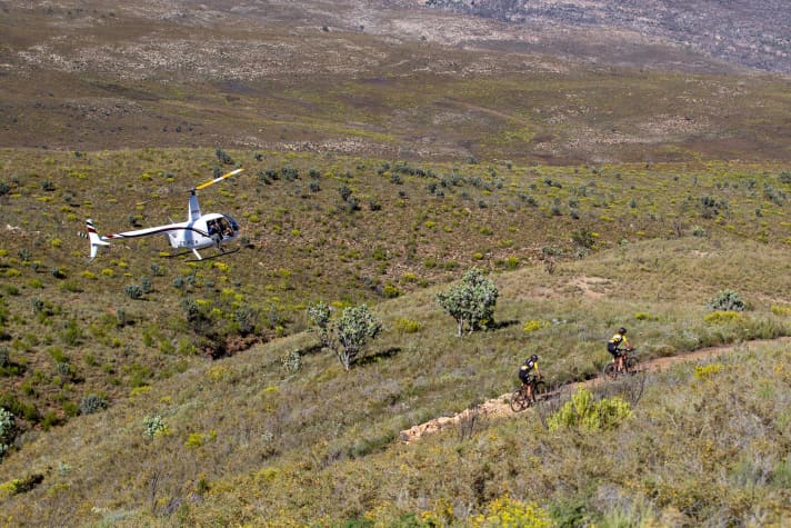   Typical Cape Epic: over dusty rugged tracks and single trails through lonely South African mountain regions.
