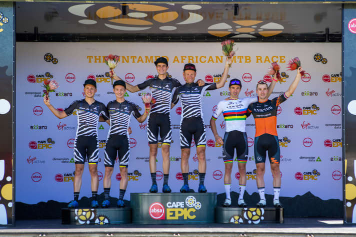   The podium of the first stage: The two Bulls teams in first and second, world champion Seewald with Stosek in third place.