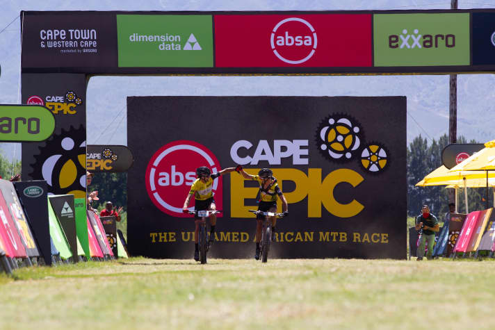   Matt Beers (left) and Jorda Sarrou, who rides with a USWE backpack, at the finish in Saronsberg.