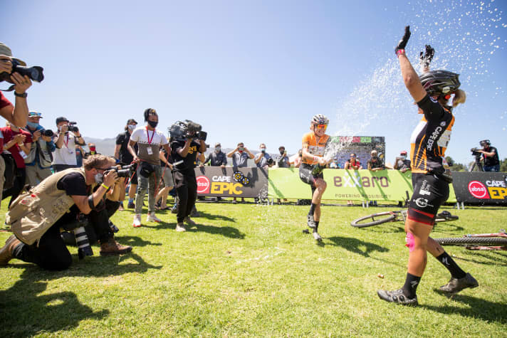   The obligatory champagne shower at the finish for Sina Frei.