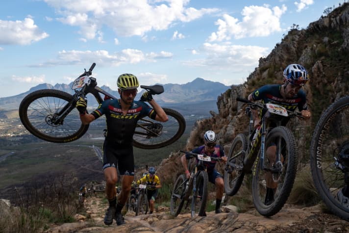 The course demands everything from the participants: even the best in the world have to get off their bikes and shoulder their bikes.