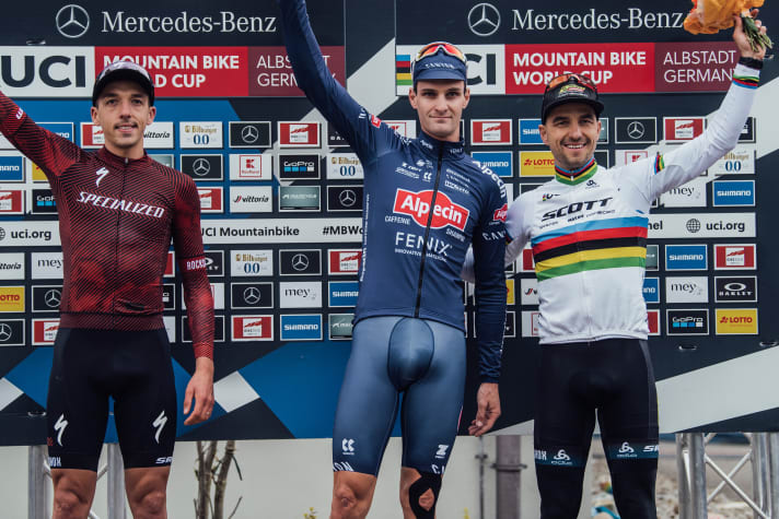   The men's podium with winner Sam Gaze (centre), Jordan Sarrou (left) and Nino Schurter.