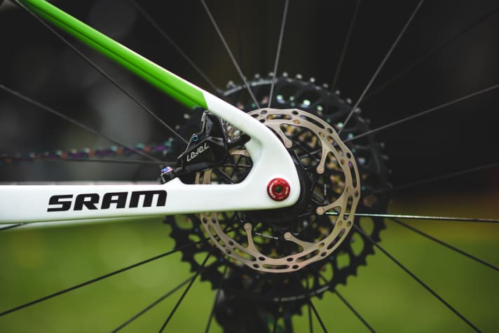   The small 140 millimetre brake disc on the rear wheel is sufficient for Evie's system weight for the relatively short descents on the World Cup courses.