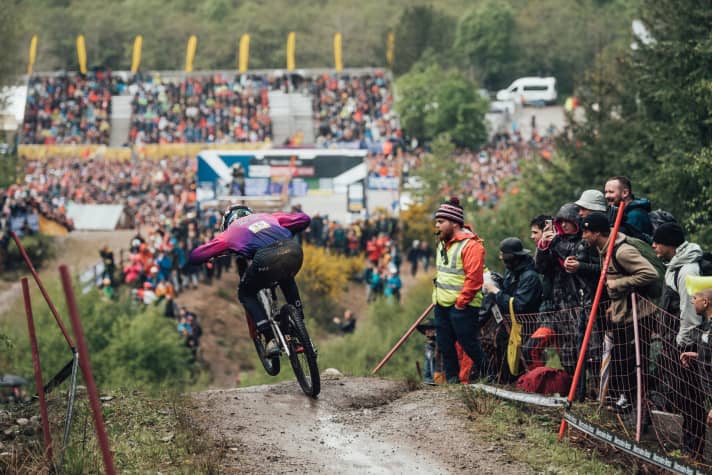   Head down: Frenchman Thibaut Daprela throws himself at the numerous fans and spectators in Fort William.