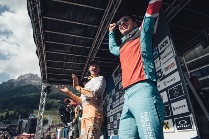   The surprise winner: Matt Walker (right) celebrates his first World Cup victory. To his left, Austria's Andreas Kolb (Atherton) celebrates fifth place in front of his home crowd.