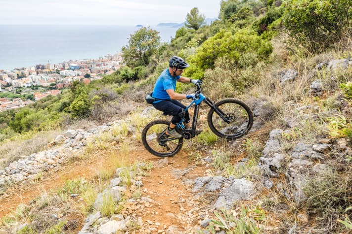 Aim: To ride with the rear wheel at least as far as the apex of the bend.