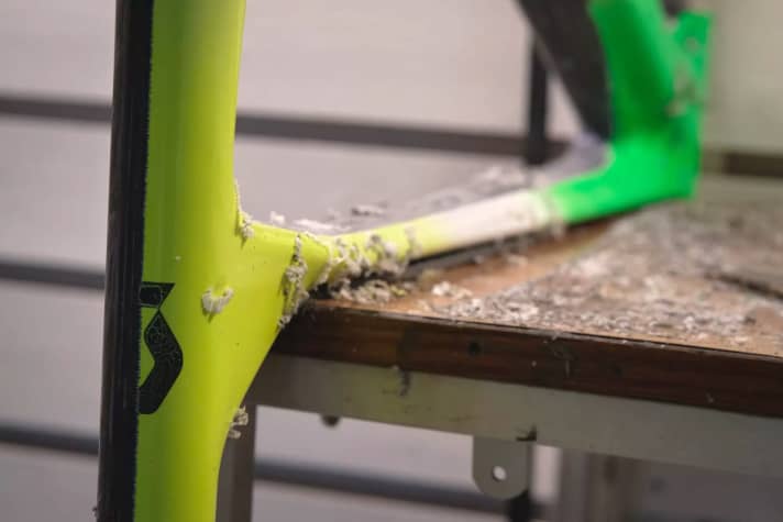 The paint has to come off, with blade and sandpaper on the frame of this Scott Sparks.