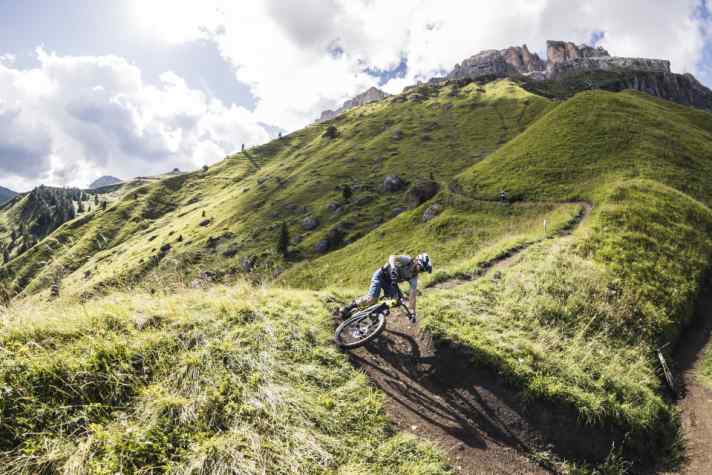 At first, the trail only tips a little steeper downhill, then the roots and rock steps really rattle the suspension.