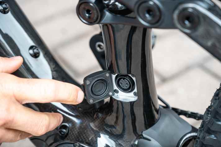 The charging port is located under a flap that closes automatically.