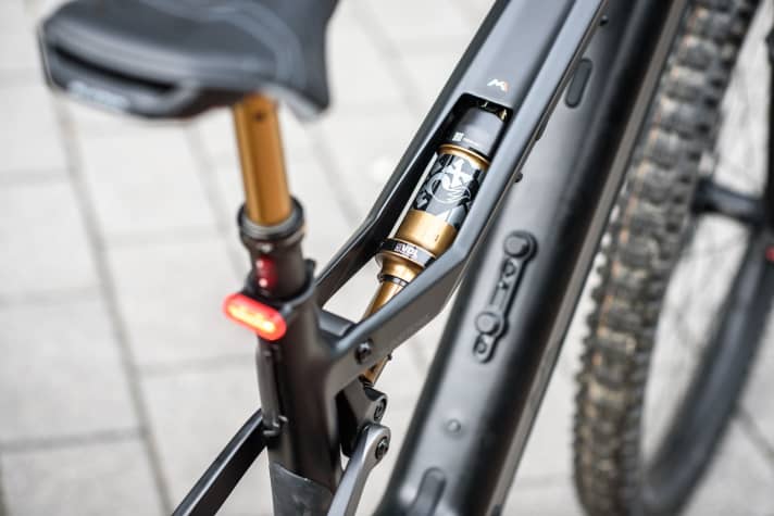 The openwork top tube is an M1 trademark.