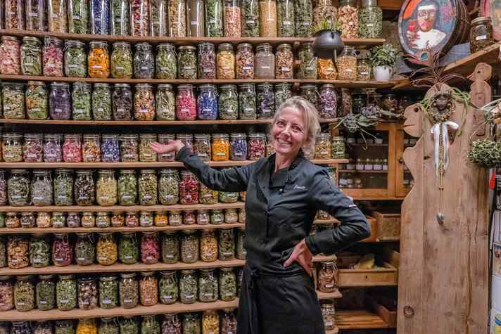 Colourful variety: Janett presents the storage shelves with herbs that are also used in the "Onkel Taa" restaurant.