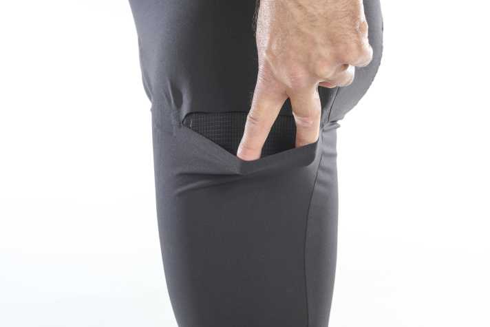 Discreet laser-cut pockets on the thighs keep bars and small items within easy reach