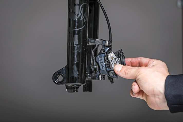 Insert the new pads into the cleaned and serviced brake. Ensure that the pads are correctly aligned.