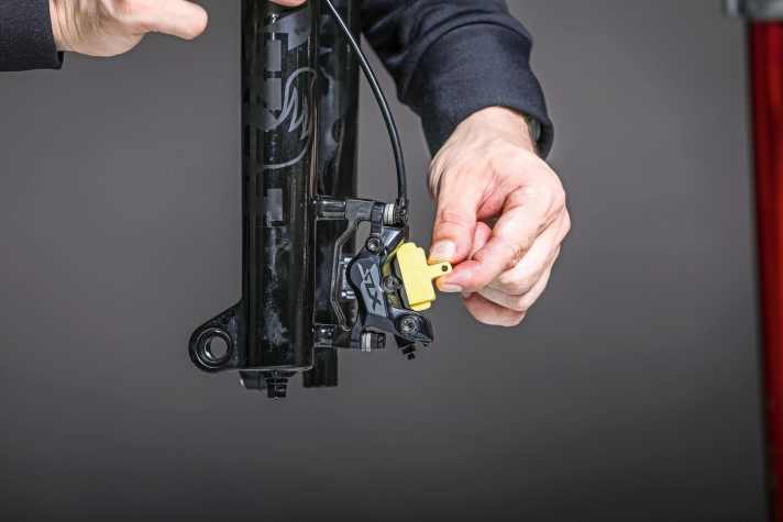 As for bleeding: Remove the pads and insert the bleed block.