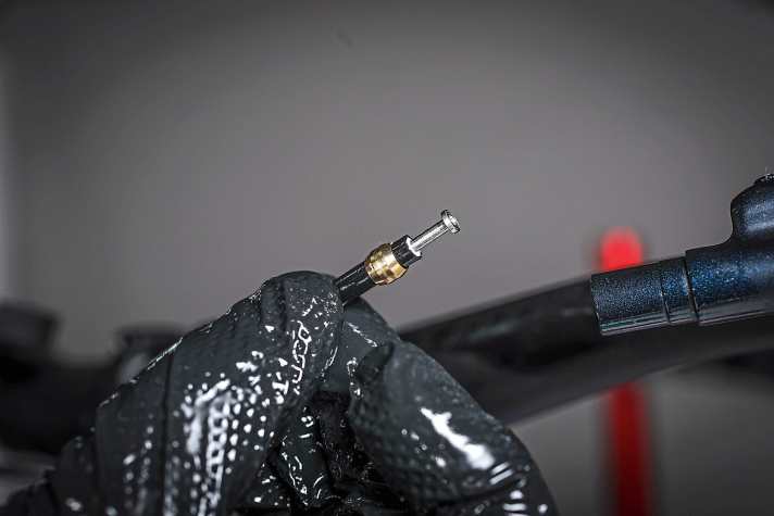 First the new olive is fitted, then the pin is crimped to the pipe by hand.