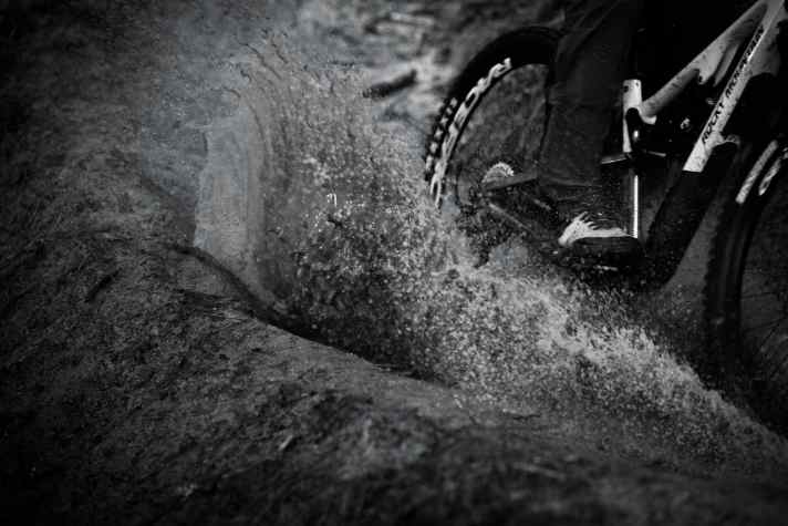 Into the puddle! With suitable clothing, there's nothing to stop you.