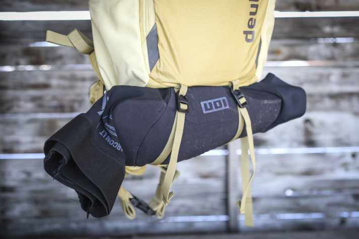 In addition to the rain cover, there are compression straps for protectors in the bottom compartment.