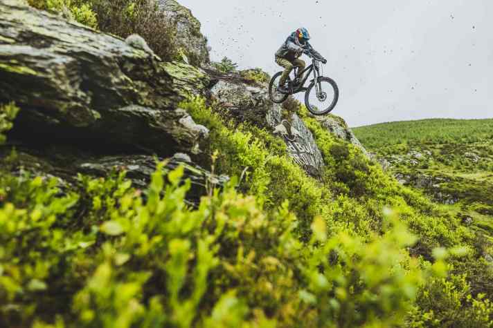 He's got it: "Jumps and drops are easy for me. I can land with pinpoint accuracy," says Tommy G. Here at the first rock drop high up in the course.