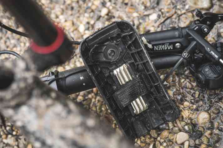 Top: Propain has integrated a mini storage compartment for a multi-tool in the battery cover.
