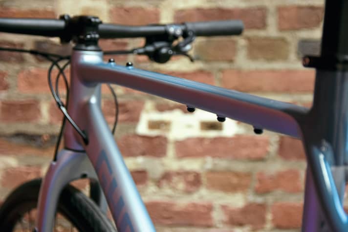 Stable tubes: aluminium is more forgiving of "enemy contact" than carbon, the Asket top tube has threads at the top and bottom for equipment.