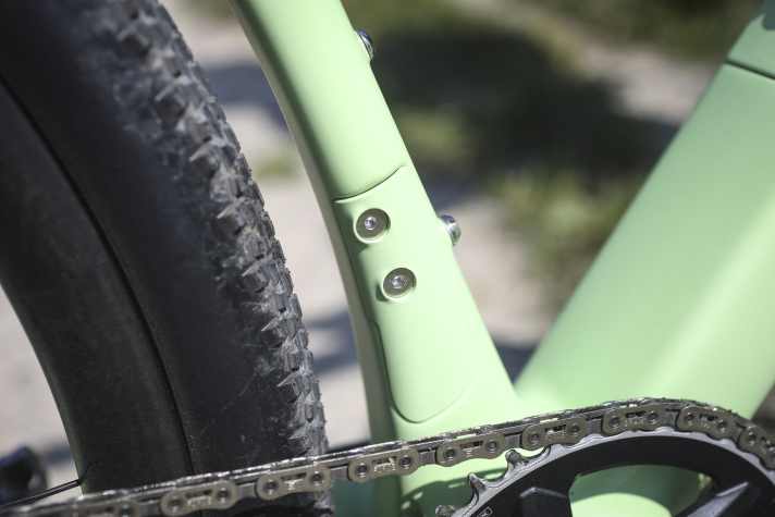 The interface for front derailleur mounting is elegantly covered on the carbon frame of the Alutech gravel bike.