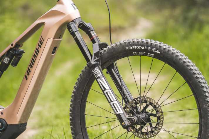 The battery is located under a cover in the down tube.