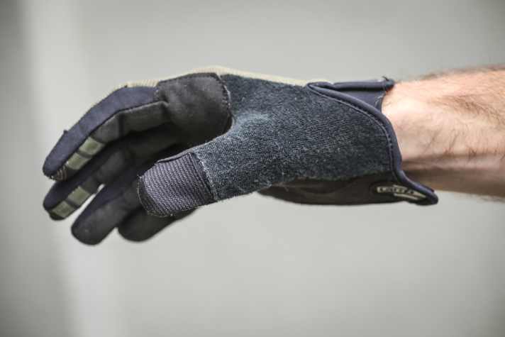 Soft material on the thumb helps to wipe the nose and glasses