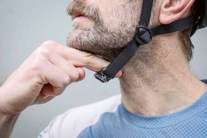 The straps should not cut into the skin. However, there should not be more than two fingers of space under the chin