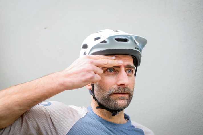 Not too wide in the forehead and not too wide in the neck. The helmet should sit horizontally