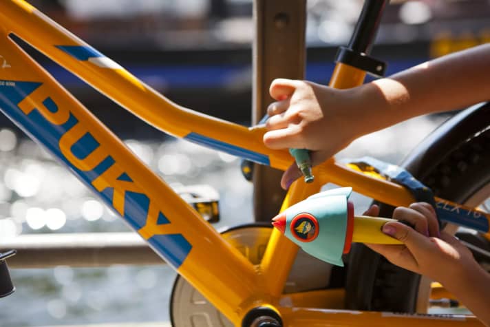 A cable or spiral cable lock is widely used. But they cannot withstand brute force for long.