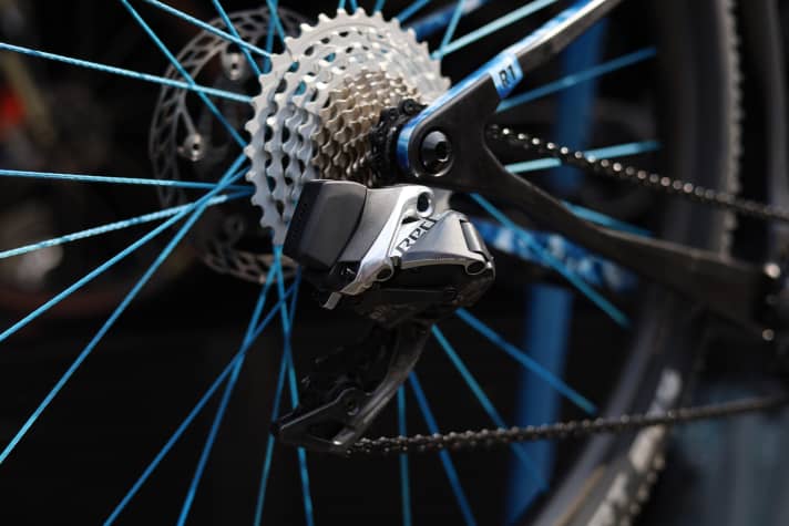A Sram Red AXS road bike rear derailleur and a Rotor cassette are among the compromises of the lightweight construction project.