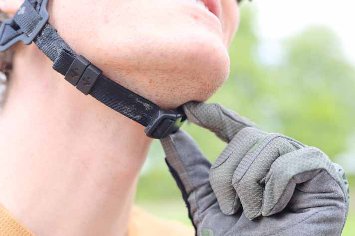 The classic fastener is child's play and doesn't pinch. The strap doesn't tug even with stubble, but it can get salty on sweaty rides.