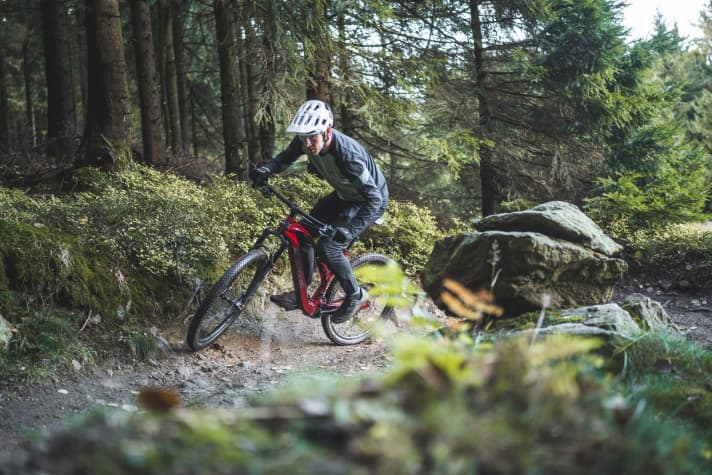 Uphill, the rider is challenged despite the motor assistance.