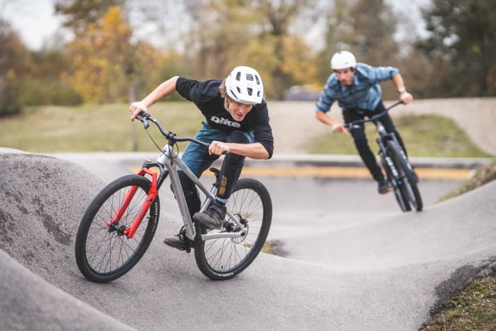 Over the pump and around the bend: pump tracks are great playgrounds for young and old, dirt bikes are the perfect companions.