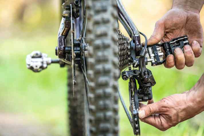 A bent derailleur hanger can be carefully straightened with a tool in the derailleur hanger and a measured application of force on the rear derailleur.