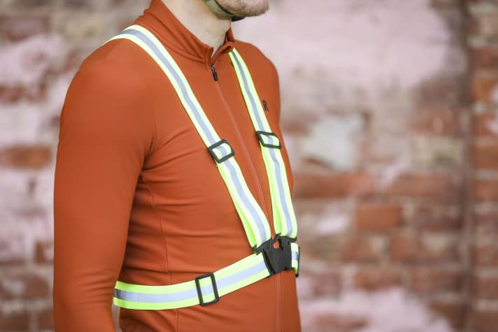 A high-visibility waistcoat or reflective belt is particularly easy for drivers to see.