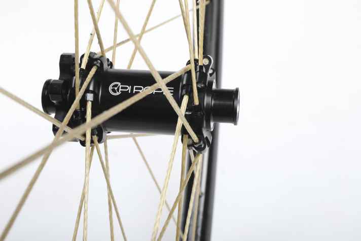 The Vectran spokes require special hubs. These come from Newmen.