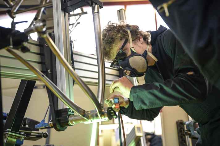 Acetylene and oxygen burn bright and hot in the soldering process to fuse the brass.