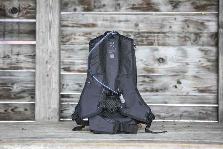 The drinking tube can be fed out of the top or bottom of the rucksack. There are no loops on the shoulder strap, so the tube rubs uncomfortably on the neck.