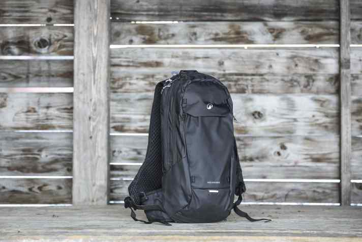 The drinking tube can be fed out of the top or bottom of the rucksack. There are no loops on the shoulder strap, so the tube rubs uncomfortably on the neck.
