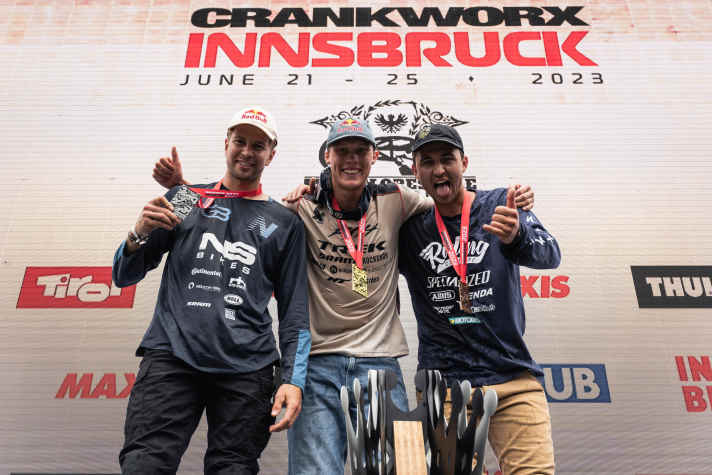 Slopestyle heroes: Dawid Godziek, Emil Johansson and Lucas Huppert celebrate their podium at the Crankworx Slopestyle in Innsbruck 2023.
