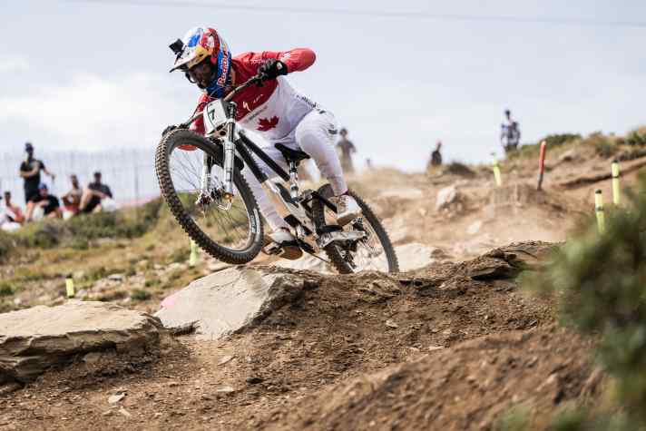 Downhill racer Finn Iles shows how it’s done: he sits right in the centre of the bike, applying plenty of pressure to the front tyre for maximum control.