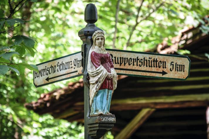 Beautiful wood carvings can be found throughout the forest.