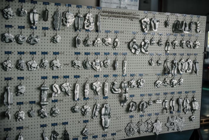 Samples of the individual workpieces hang in the Tektro factory to ensure consistent quality.