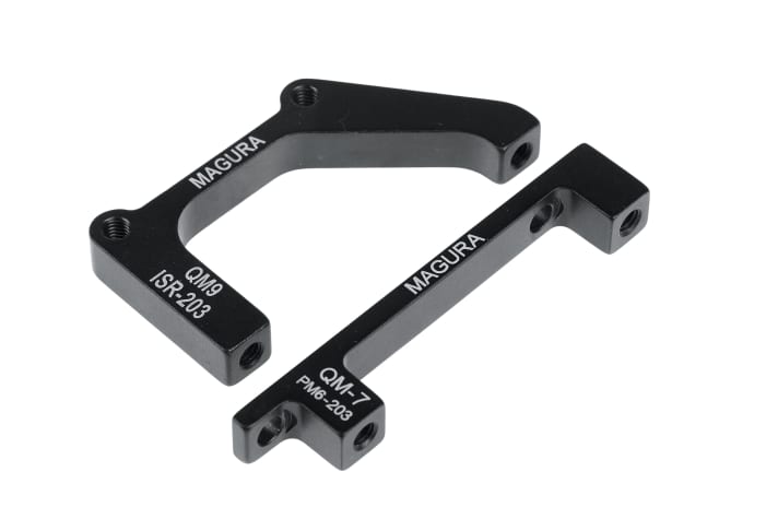 Zwei Magura-Adapter für 203 mm: oben für IS2000 hinten, unten für Postmount vorne.