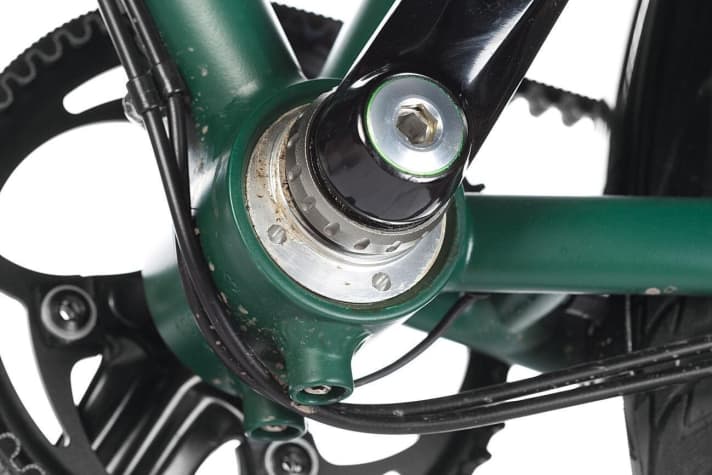 The bottom bracket rotates in a frame eccentric for correct belt tension.