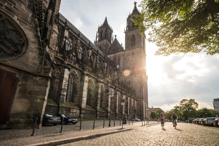 Cyclists in front of Magdeburg Cathedral