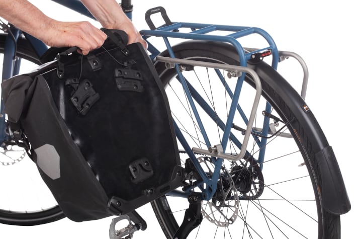 Panniers can be attached to luggage racks in a matter of seconds.